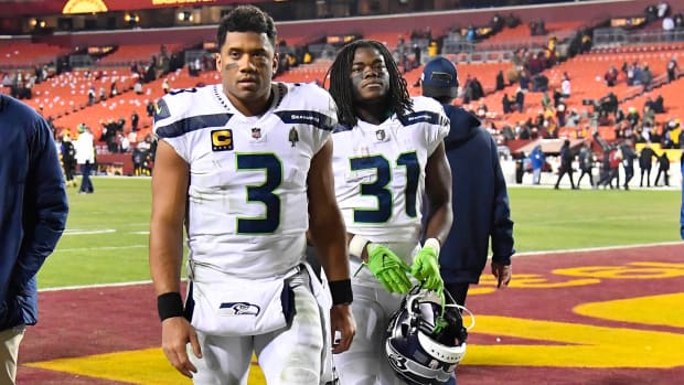 Russell Wilson walks off the field after a Monday night loss to Washington